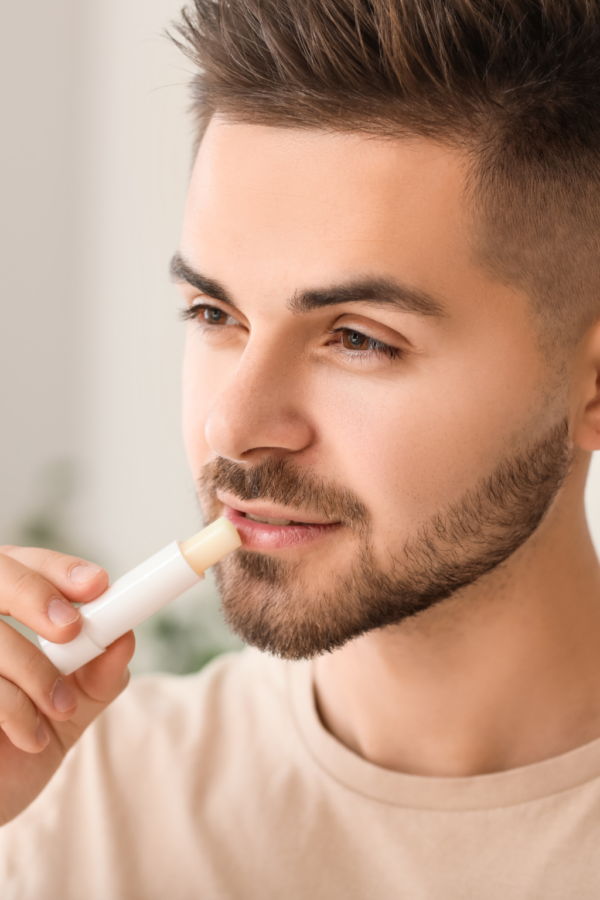 guy using lipbalm