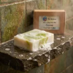 coconut soap bar on a rugged spa style shower shelf