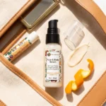 serum orange flat lay in bag witrh lip balm
