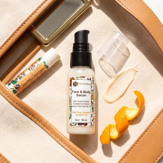 serum orange flat lay in bag witrh lip balm