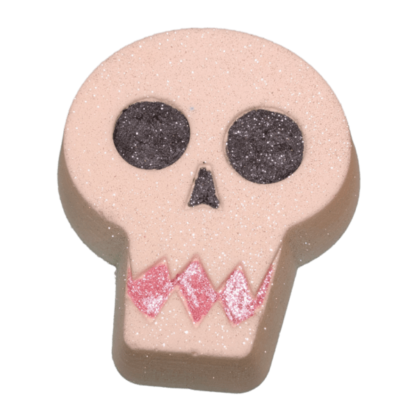 Halloween Skull-shaped bath bomb with black eyes, nose, and glittery pink teeth design